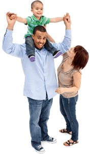 Two parents and a young child being held on his father's shoulders Two parents and a young child being held on his father's shoulders